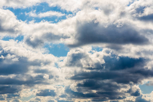 istock White fluffy clouds in the blue sky background.Cloudy white blue sky in the nice blue heaven sky. 1369893114