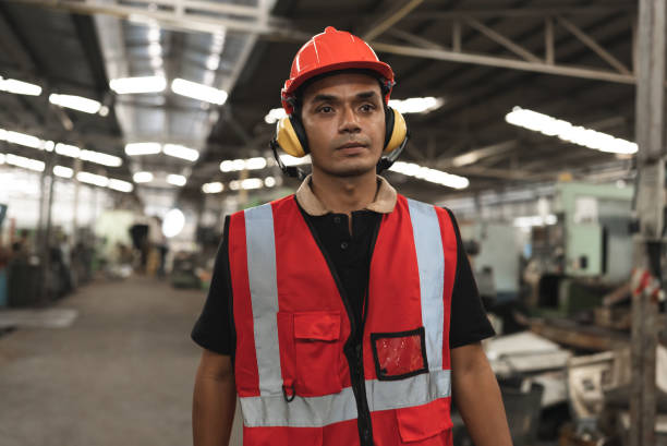 istock Portrait engineer, foreman hard work with machine at factory 1369895305