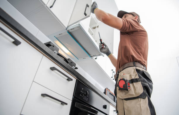 istock Residential Cabinetmaker Worker Finishing New Kitchen Installation 1369896283