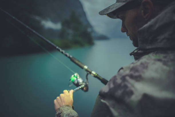 Evening Time Fly Fishing. Caucasian Fisherman with His Rod. Recreation Theme.