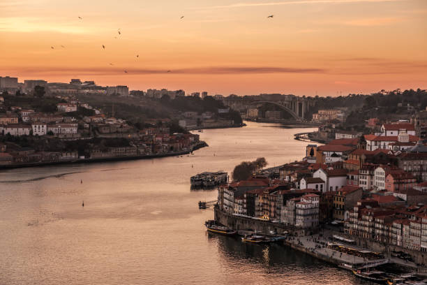 sunset at the riverside of porto - portugal - porto portugal bridge international landmark imagens e fotografias de stock
