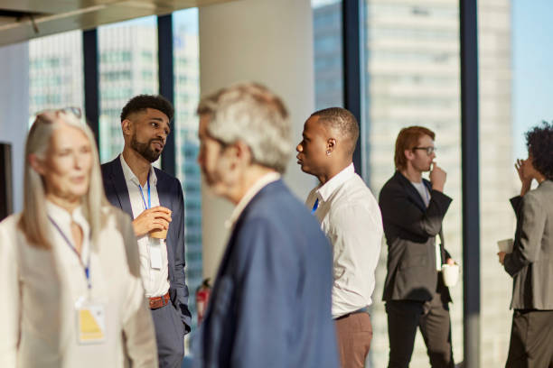 istock Diverse group of executives taking a break in meeting room 1369899321