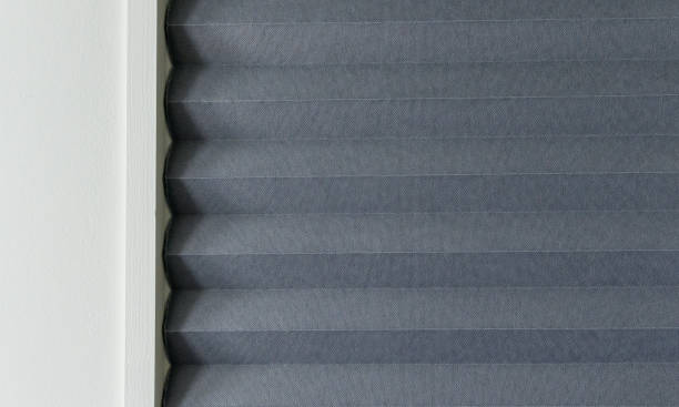 Texture of gray paper curtains inside a framed wooden door