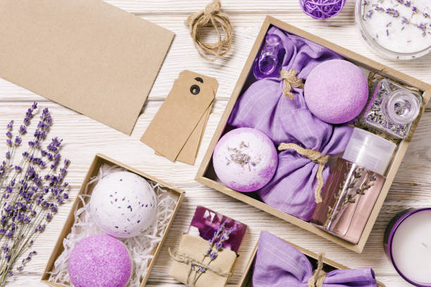 istock Products with lavender essential oil as handmade gift box, bath bombs, lavender spray and sachets on wooden table. Mindful gifting, natural aromatherapy cosmetics for body care 1369903250
