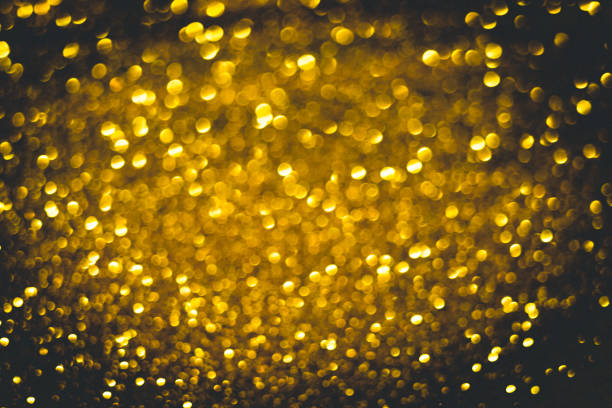 istock Golden background with round gold circles and black vignette 1369904486