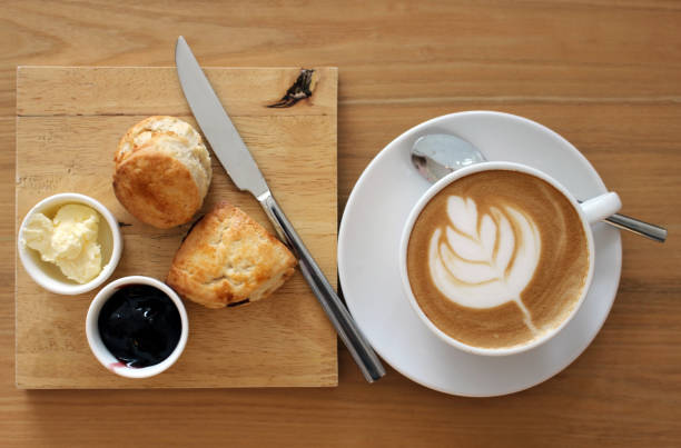 istock Overhead view of coffee and scones 1369907899