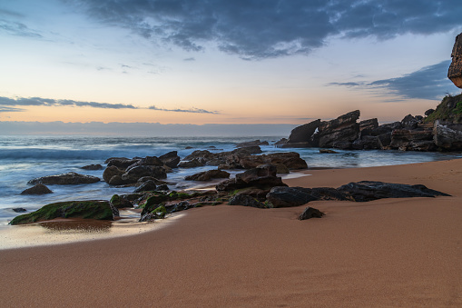 Sunrise seascape with clouds at Killcare Beach on the Central Coast, NSW, Australia.