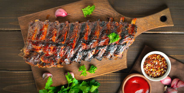 istock Grilled pork ribs on cutting board 1369911030