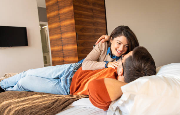 istock Couple resting together, lying on the bed. 1369914053