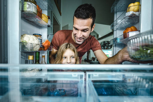 istock Sweetie, let's pick something to eat from a fridge! 1369915264