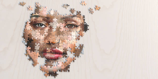 Jigsaw Puzzle Of Multi-Ethnic Female Face A close up image of a partly assembled jigsaw puzzle of a generic female face made of many different ethnicities and skin colours. The puzzle is on a light plain wooden surface, and shot with shallow depth of field with focus on the eyes. With copy space. social inclusion stock pictures, royalty-free photos & images