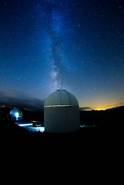istock Astronomical observatory in the mountain with the milkyway 1369915814