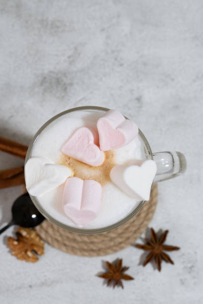 istock Coffee foam is poured into a mug with milk. Making latte 1369915923