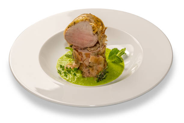 istock Baked pork fillet on pea cream 1369917039