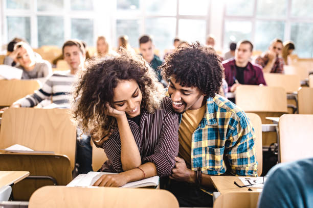 istock Happy black couple enjoying on a class at the university. 1369917440