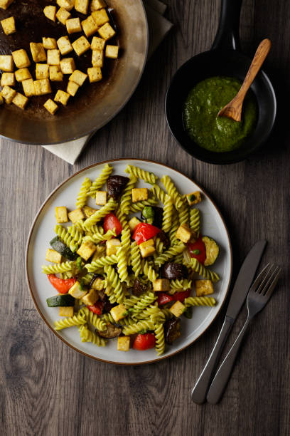 Healthy roasted vegetable with fusilli pasta and fried tofu