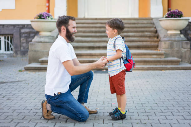 istock Single father sending his son to school 1369917592