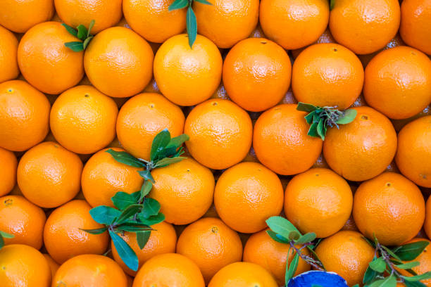 istock Organic oranges sale on market stall 1369919007