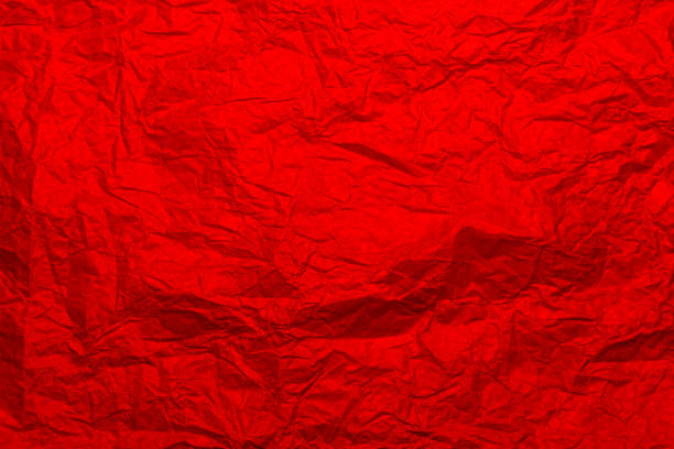 istock Crumpled craft red color paper texture 1369919274