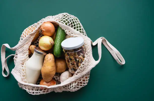 Shopping, healthy eating, blue background, glass bottle, sustainable living, plastic free, zero waste