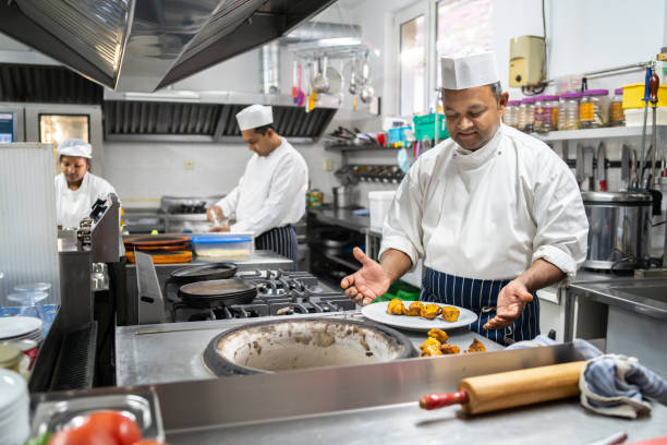 istock Indian chefs cooking in a professional kitchen 1369920209