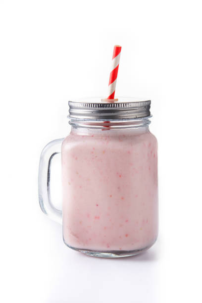 istock Fresh strawberry and banana smoothie in jar 1369920889