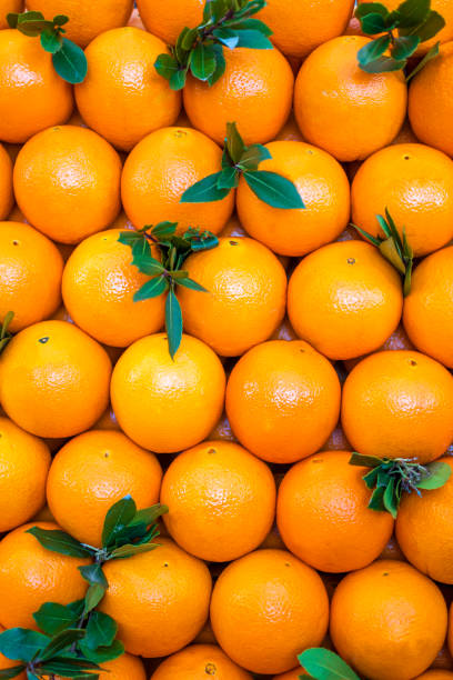 istock Organic oranges sale on market stall 1369923024