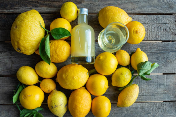 Limoncello liqueur on rustic wood
