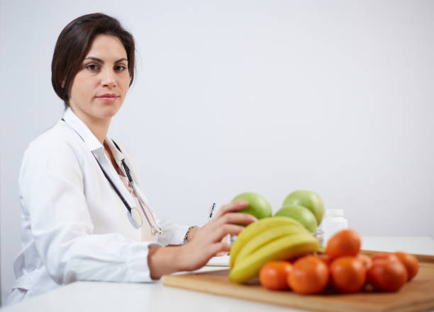 istock Beautiful smiling nutritionist 1369924804