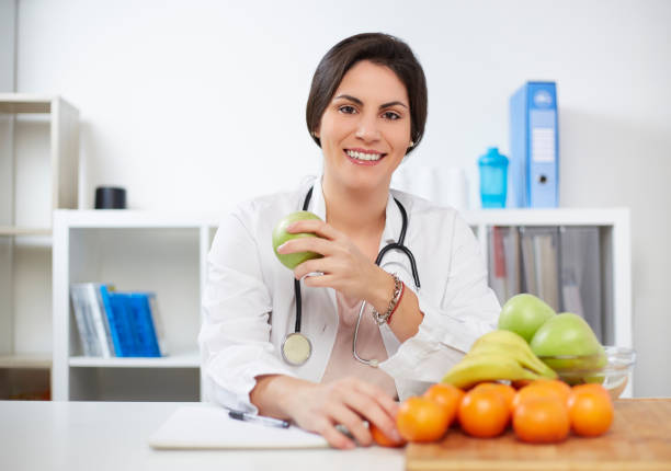 istock Beautiful smiling nutritionist 1369924822