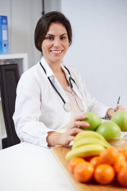 istock Beautiful smiling nutritionist 1369924834