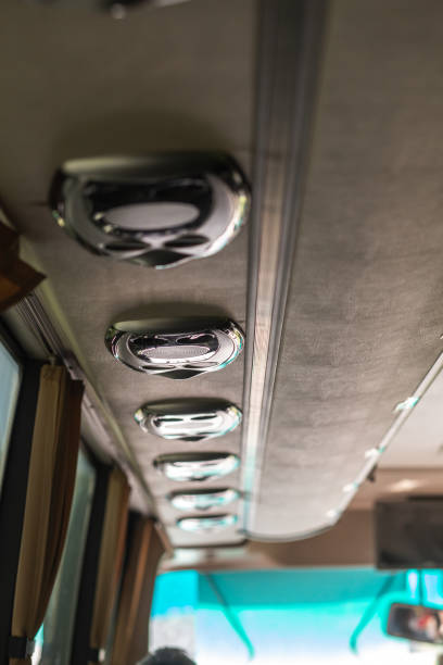 istock Row of air conditioning system in shuttle bus, making cool fresh air all inside the bus, soft focus 1369924861