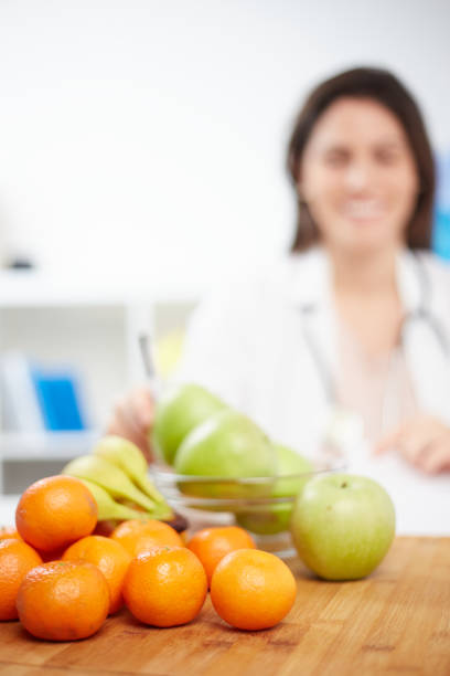 istock Beautiful smiling nutritionist 1369924897
