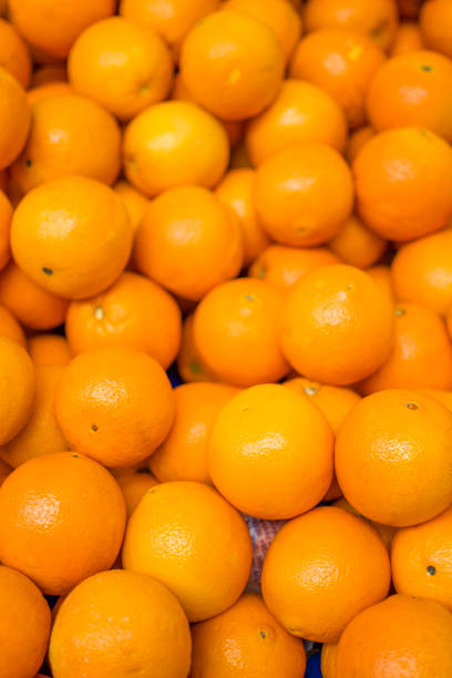 istock Organic oranges sale on market stall 1369924920