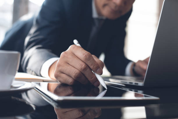 istock Businessman working in modern office 1369924929