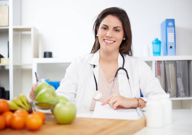 istock Beautiful smiling nutritionist 1369924964