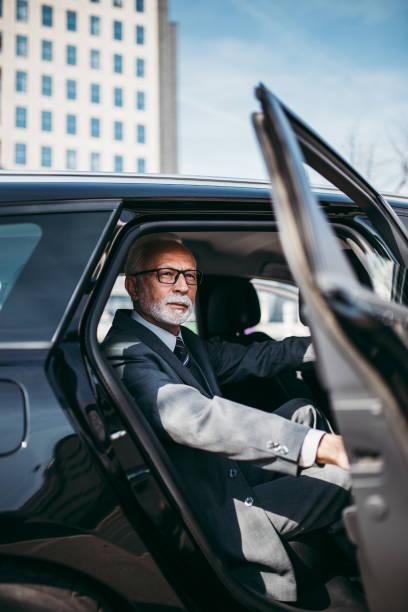 istock Senior business man in car 1369925499