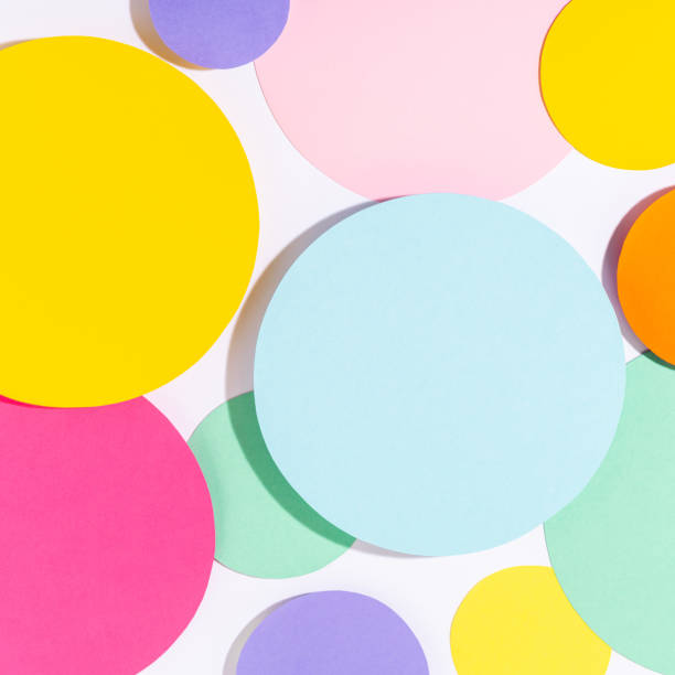 istock Multicoloured bright lit mosaic of paper circles. 1369926046