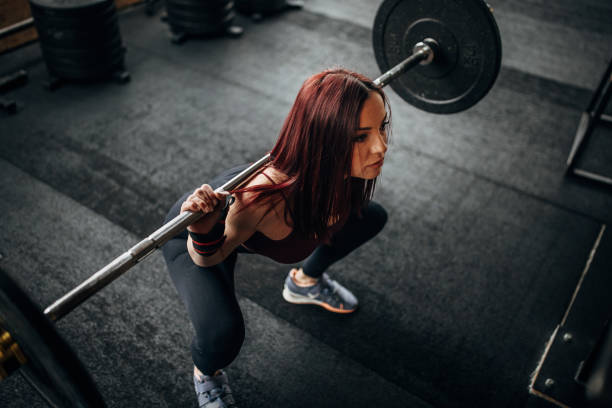 istock Fit woman exercising with weights 1369926256