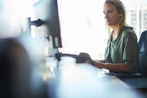 istock Businesswoman focused on a computer 1369928054
