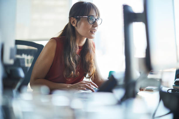 istock A businesswoman is looking closely at the computer screen. 1369928066