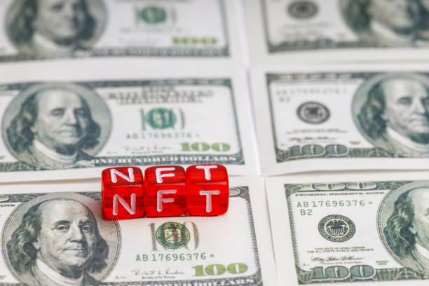 istock NFT word on red cubes found on one hundred dollar bills 1369928125