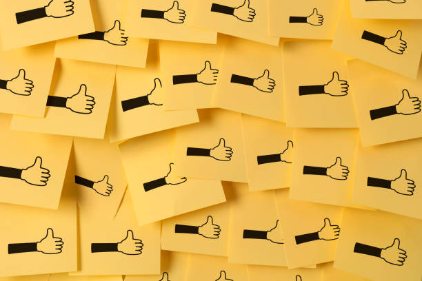 Thumbs up icon on adhesive note paper