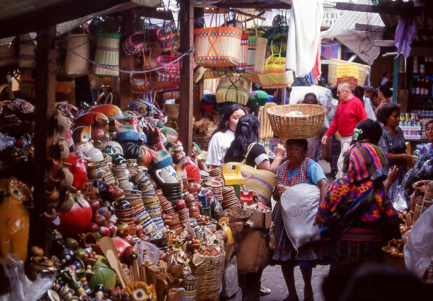 Antigua, Guatemala - aug 16, 1988: Antigua, Guatemala - aug 16, 1988: women and all kinds of wares at the Antigua market