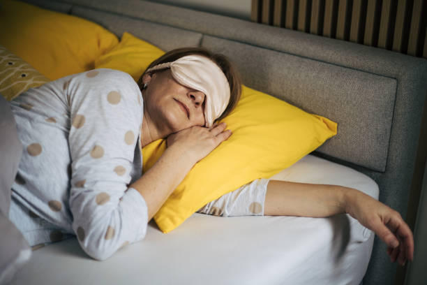 istock Senior woman in bed. 1369930749