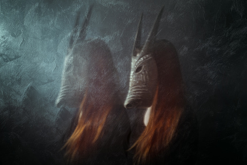 Redhead woman wearing mask, long exposure