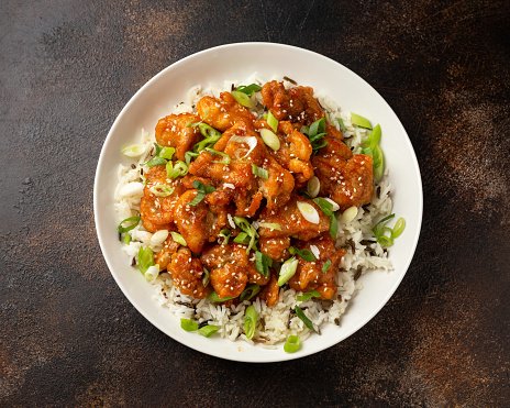 Asian crispy sweet sesame chicken with basmati, wild rice and spring onion