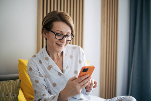 istock Senior woman in bed. 1369931239