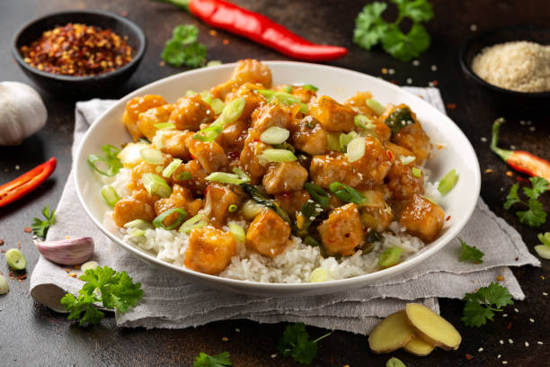 general tso tofu with rice, green onion and pak choi. asian vegan food - chicken general tso food imagens e fotografias de stock