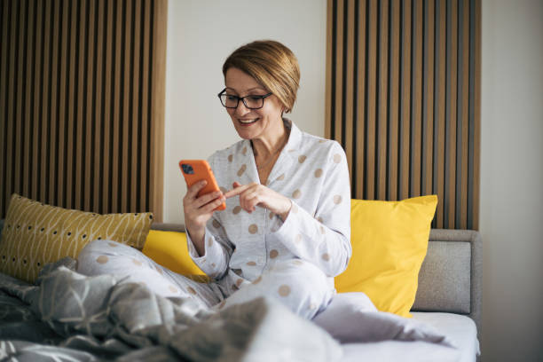 istock Senior woman in bed. 1369931374